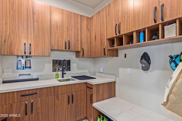 kitchen featuring brown cabinetry, modern cabinets, open shelves, and light countertops