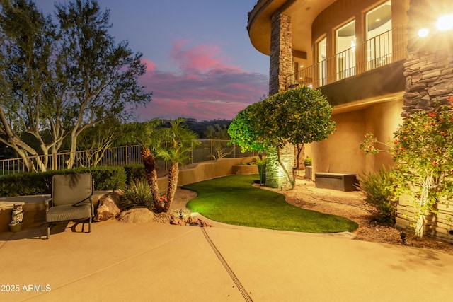 view of patio featuring fence