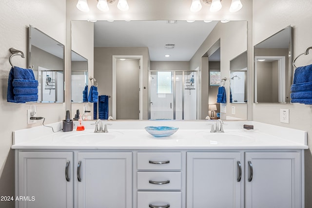 bathroom with vanity and an enclosed shower