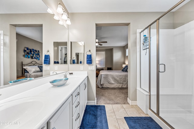 bathroom with vanity, tile patterned floors, a shower with door, and ceiling fan