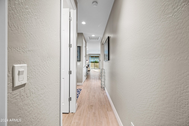 corridor featuring light wood-type flooring