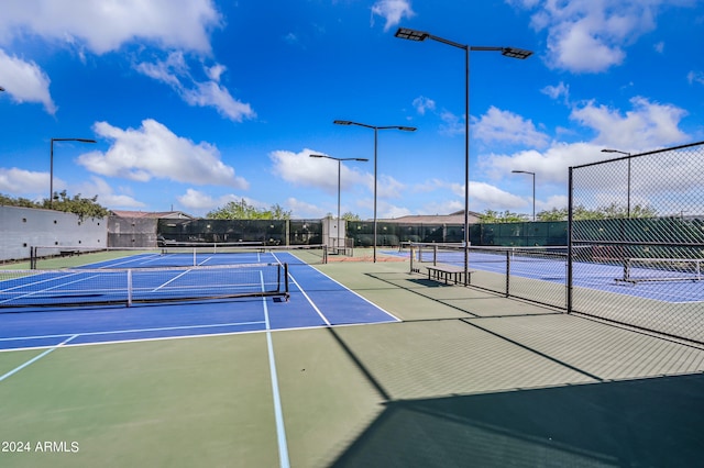 view of sport court featuring basketball hoop