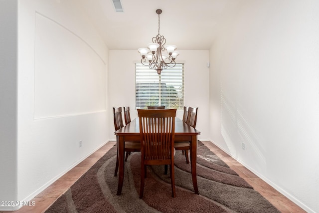 dining area with a notable chandelier