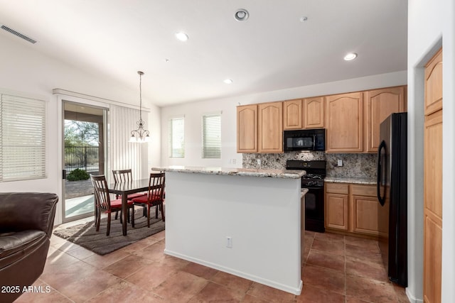 kitchen with light stone counters, a chandelier, pendant lighting, decorative backsplash, and black appliances