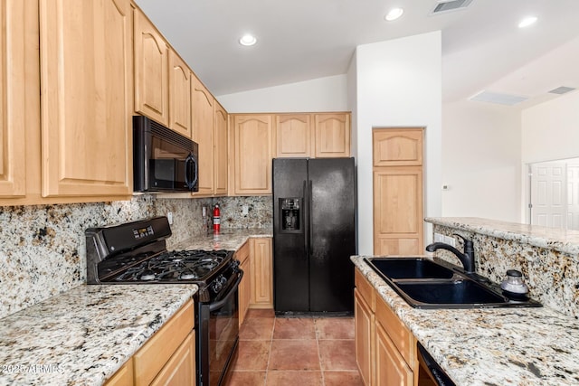 kitchen with light brown cabinetry, decorative backsplash, sink, and black appliances