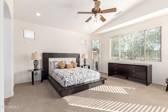 bedroom featuring multiple windows, light carpet, ceiling fan, and lofted ceiling