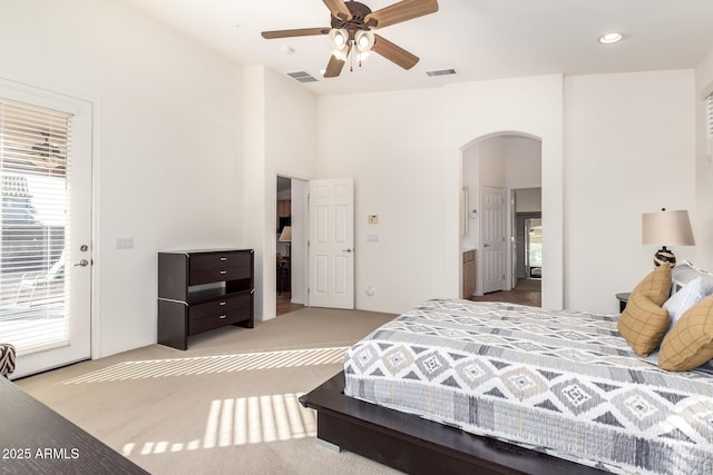 carpeted bedroom featuring access to exterior and ceiling fan