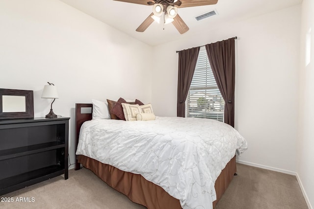 bedroom with light colored carpet and ceiling fan