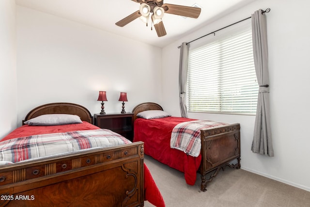 bedroom featuring ceiling fan and light carpet