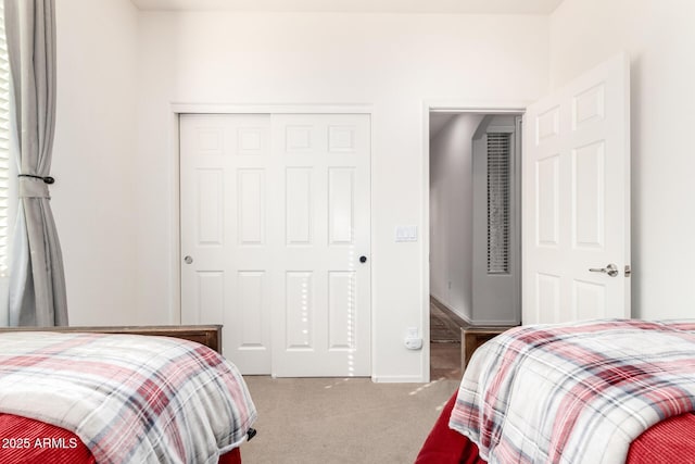 carpeted bedroom with a closet