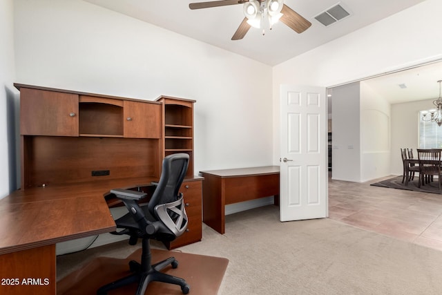 office featuring light carpet and ceiling fan with notable chandelier