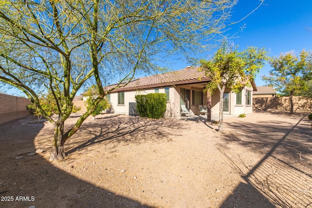 rear view of property featuring a patio