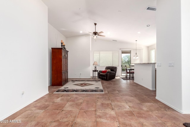 living room featuring ceiling fan and vaulted ceiling