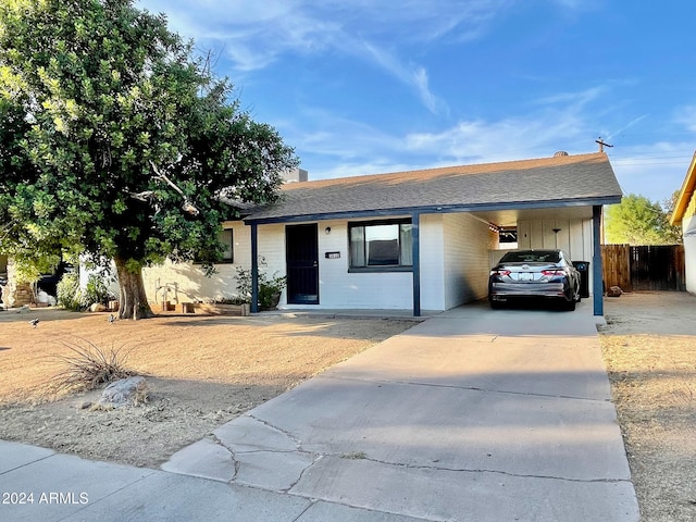 single story home with a carport