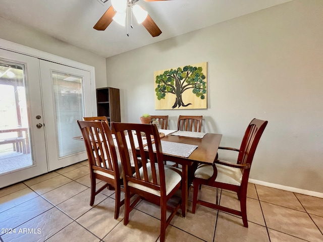 tiled dining space with french doors and ceiling fan