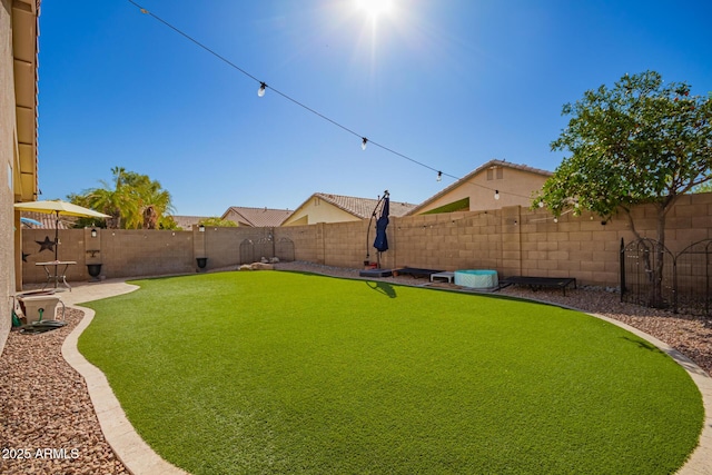 view of yard featuring a fenced backyard