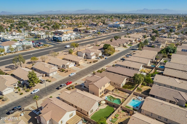 birds eye view of property with a residential view