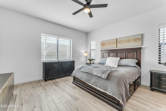 bedroom featuring light wood-type flooring and ceiling fan