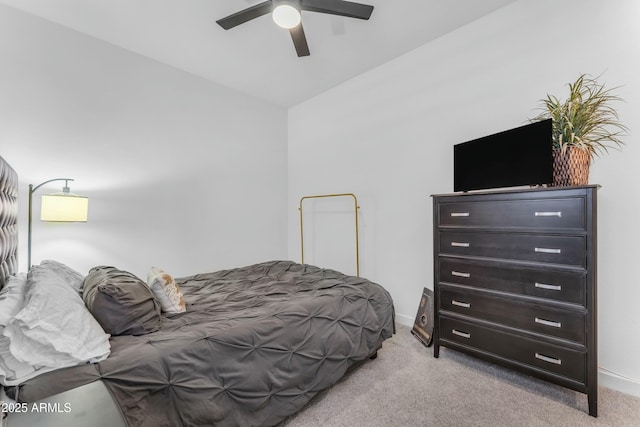 bedroom featuring ceiling fan and light carpet