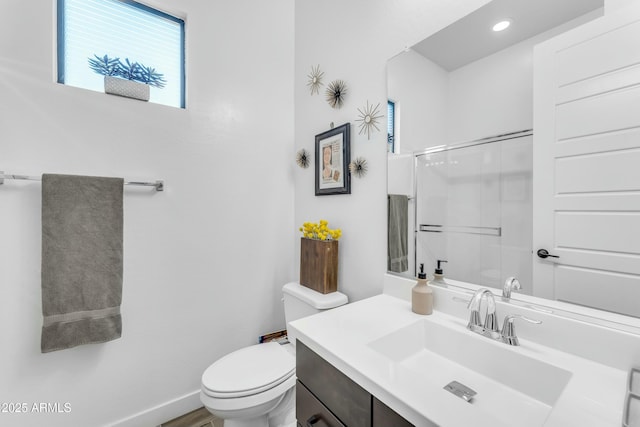 bathroom with toilet and vanity