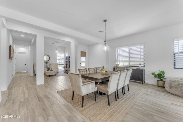 dining room with light hardwood / wood-style floors