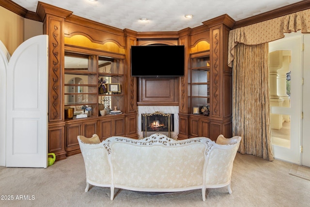 11809 S Montezuma Ct, Phoenix, AZ 85044 - living area featuring light carpet, a premium fireplace, and ornamental molding