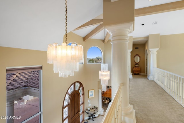11809 S Montezuma Ct, Phoenix, AZ 85044 - hall with a chandelier, decorative columns, carpet floors, and high vaulted ceiling