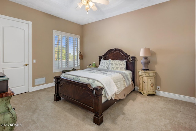 11809 S Montezuma Ct, Phoenix, AZ 85044 - bedroom with light carpet, baseboards, and a ceiling fan