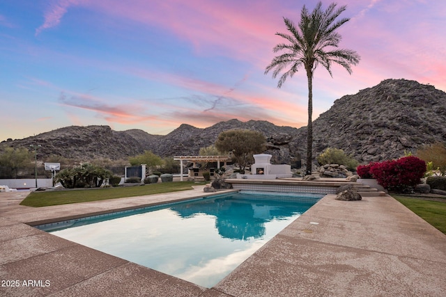 11809 S Montezuma Ct, Phoenix, AZ 85044 - pool at dusk with a mountain view, a patio area, an outdoor pool, and a pergola