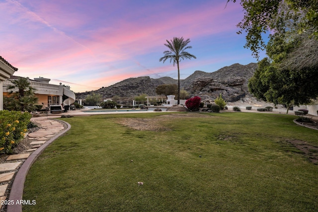 11809 S Montezuma Ct, Phoenix, AZ 85044 - view of green lawn with a mountain view and an outdoor pool