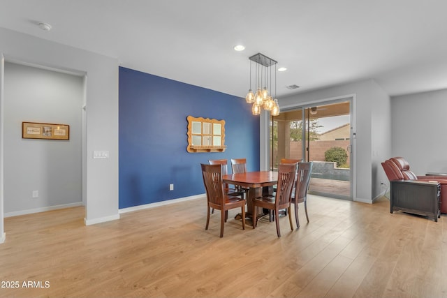 696 W Glen Canyon Dr, San Tan Valley, AZ 85140 - dining area with a chandelier, baseboards, and light wood-style floors