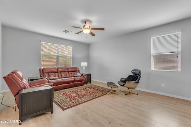 696 W Glen Canyon Dr, San Tan Valley, AZ 85140 - living room with light wood-type flooring, baseboards, visible vents, and ceiling fan