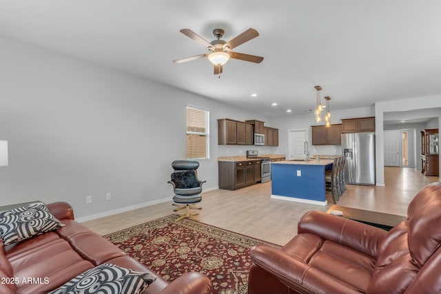 696 W Glen Canyon Dr, San Tan Valley, AZ 85140 - living area featuring recessed lighting, baseboards, light wood finished floors, and ceiling fan