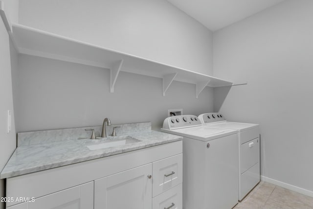 696 W Glen Canyon Dr, San Tan Valley, AZ 85140 - washroom featuring light tile patterned floors, baseboards, washing machine and clothes dryer, cabinet space, and a sink