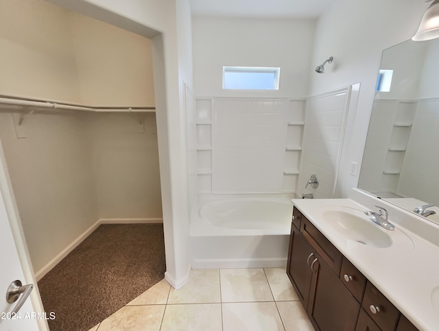 bathroom featuring tile flooring, shower / tub combination, and vanity