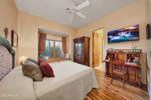 bedroom with light hardwood / wood-style floors and ceiling fan