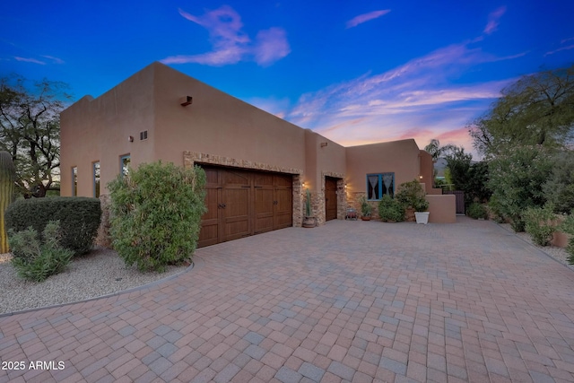 southwest-style home with a garage