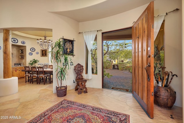 entrance foyer with an inviting chandelier