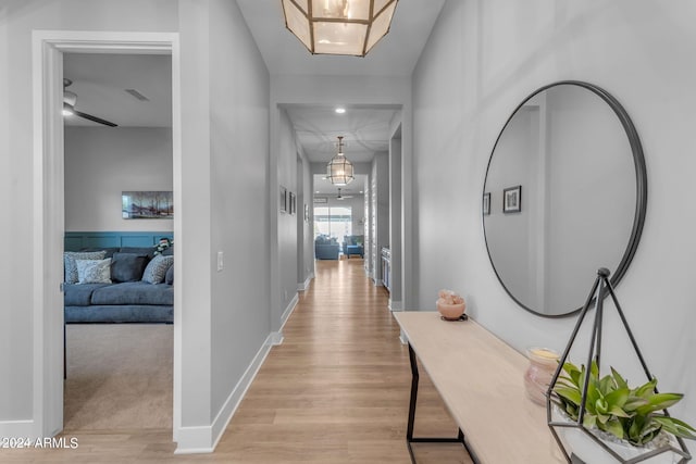 corridor featuring light hardwood / wood-style floors