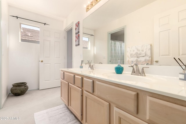 bathroom featuring double vanity and a sink