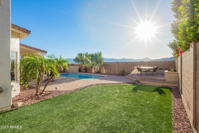 view of yard with a patio, a fenced in pool, and a fenced backyard