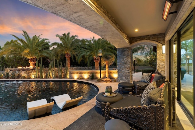 patio terrace at dusk with pool water feature