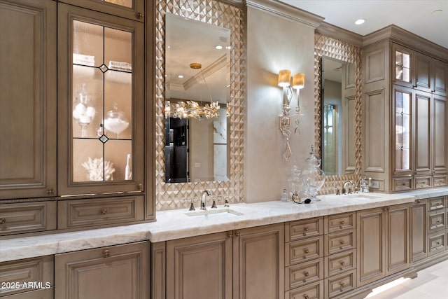 bathroom with tasteful backsplash, ornamental molding, and vanity