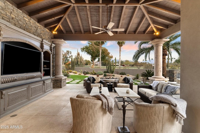 patio terrace at dusk with an outdoor living space, a gazebo, and ceiling fan