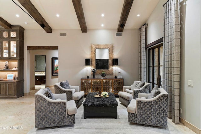 living room with beam ceiling