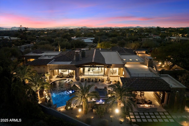 exterior space featuring pool water feature and a patio area