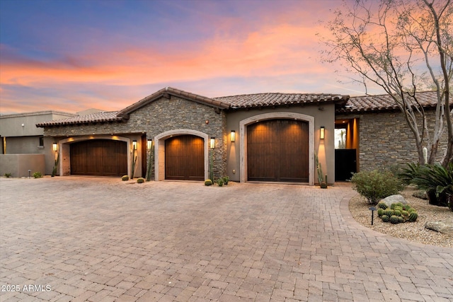 mediterranean / spanish-style home featuring a garage