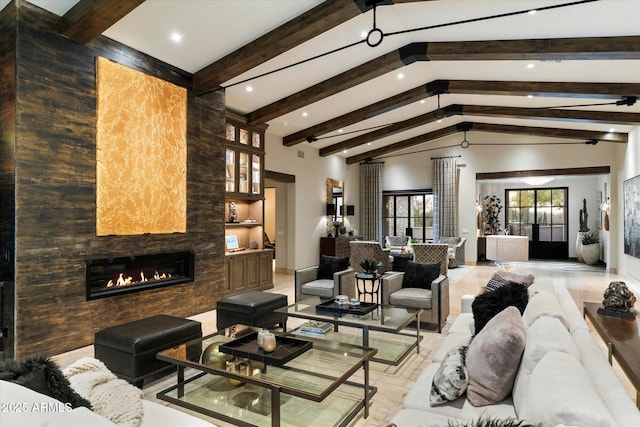 living room featuring a large fireplace, beam ceiling, and high vaulted ceiling