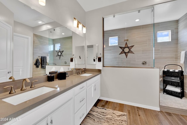 bathroom featuring vanity and a tile shower