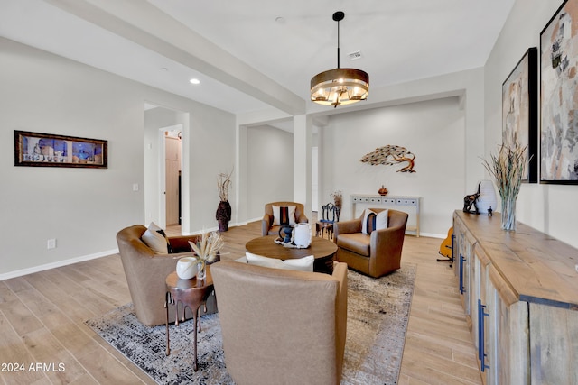 interior space featuring a notable chandelier and light wood-type flooring